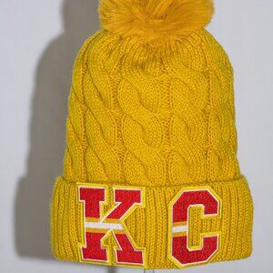 K.C. fuzzy lined stocking cap in Chiefs Yellow and faux pom-pom